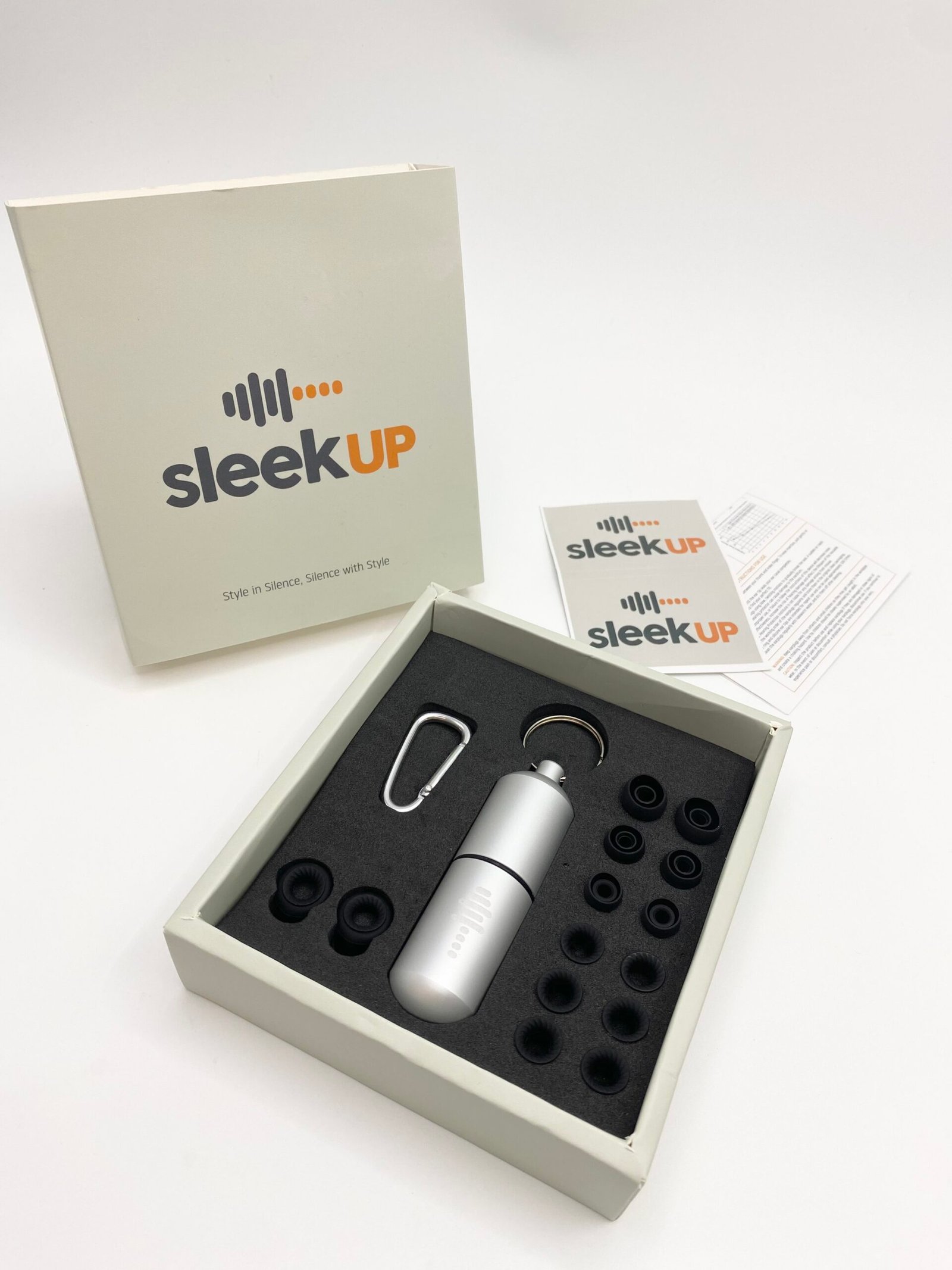 Discover the complete Sleekup experience with our comprehensive earplugs kit! Inside, you'll find 4 pairs of ear cups (XS, S, M, L) and 4 pairs of filter inner rings for customizable noise reduction. Plus, our portable carrying case comes with an adapter for easy attachment, along with two stickers and a manual to enhance your journey to tranquility. Elevate your comfort and security with Sleekup